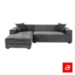 Sophisticated modern living room interior showcasing a luxury l-shape sectional sofa upholstered in soft warm gray velvet featuring matching throw pillows and a patterned throw blanket by Bahoo Furniture UAE