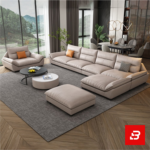 Elegant modern luxury living room interior showcasing a spacious contemporary sectional sofa with an attached chaise lounge upholstered in soft warm gray fabric with matching orange accent cushions by Bahoo Furniture UAE